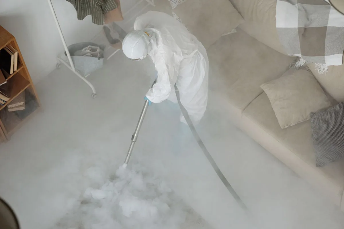 Biohazard cleanup technician in protective equipment, College Heights, Milwaukee, WI